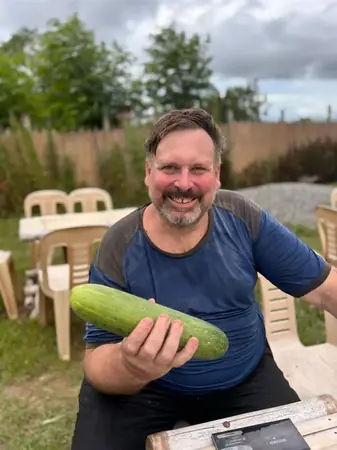 Bill from B&Y Agriventures with fresh produce grown on the farm